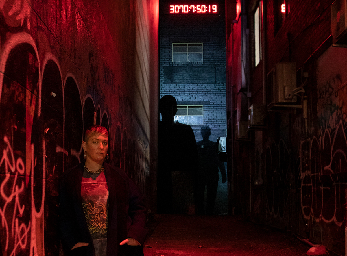 Yandell Walton End Passage, a red digital countdown clock appears at the end of a long dark alley.